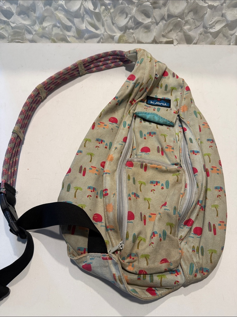 Kavu Beach Print Crossbody Sling Bag - Beige with Turquoise & Red Accents